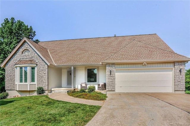 222 Chippewa Ln, Lake Winnebago, MO 64034 - view of front of property with stone siding, a garage, concrete driveway, and a front yard