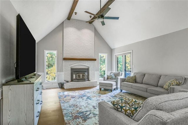222 Chippewa Ln, Lake Winnebago, MO 64034 - living area with ceiling fan, beam ceiling, wood finished floors, a brick fireplace, and high vaulted ceiling