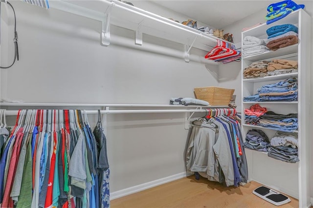 222 Chippewa Ln, Lake Winnebago, MO 64034 - walk in closet featuring wood finished floors