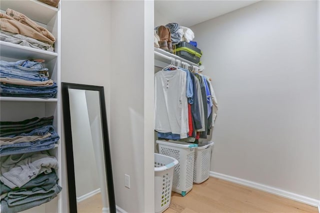 222 Chippewa Ln, Lake Winnebago, MO 64034 - spacious closet with wood finished floors