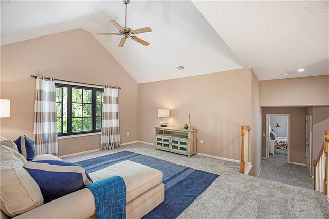 living room featuring vaulted ceiling, a ceiling fan, carpet flooring, and visible vents