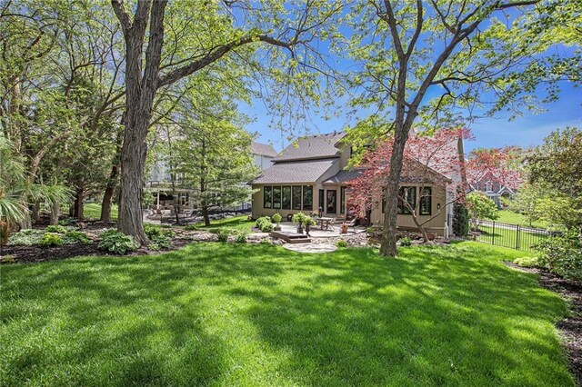 view of yard featuring a patio and fence