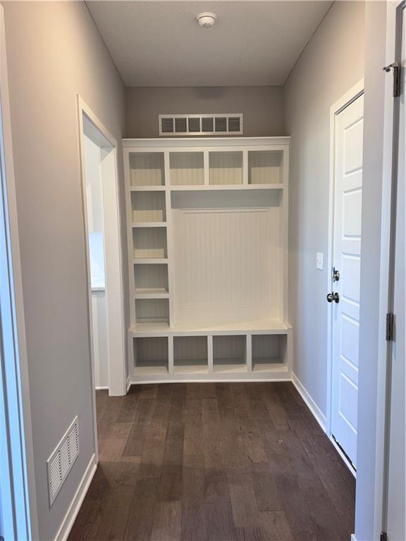 11432 S Langley St, Olathe, KS 66061 - mudroom featuring visible vents, baseboards, and dark wood finished floors