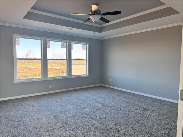 11432 S Langley St, Olathe, KS 66061 - empty room featuring baseboards, a raised ceiling, ornamental molding, ceiling fan, and carpet floors