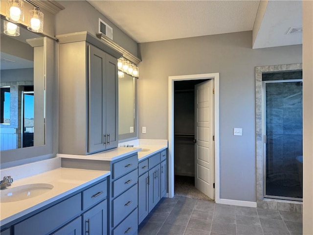 11432 S Langley St, Olathe, KS 66061 - full bathroom featuring vanity, visible vents, baseboards, and a stall shower