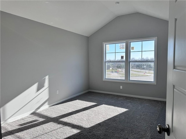 11432 S Langley St, Olathe, KS 66061 - empty room featuring baseboards, dark colored carpet, and vaulted ceiling