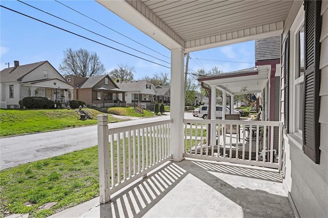 view of patio / terrace with covered porch and a residential view