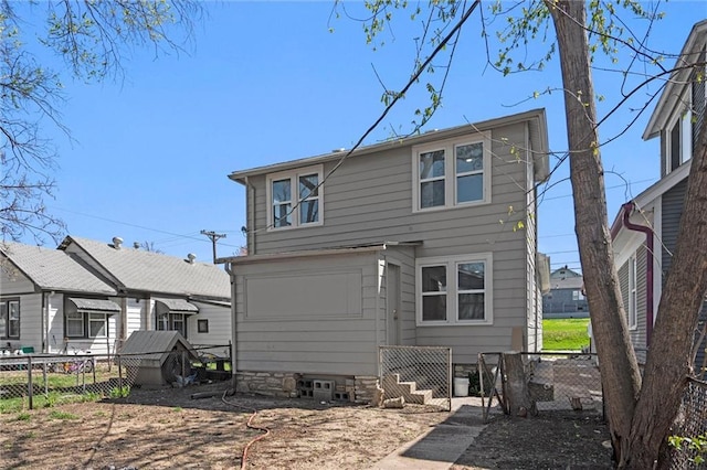 back of property with fence