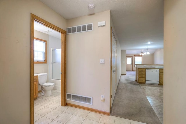 hall with visible vents and plenty of natural light