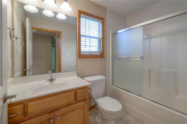 full bath featuring toilet, enclosed tub / shower combo, tile patterned flooring, and vanity