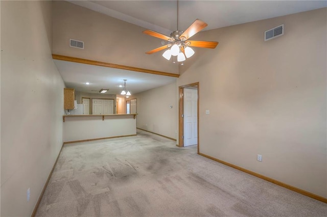 unfurnished living room with visible vents, baseboards, and light colored carpet