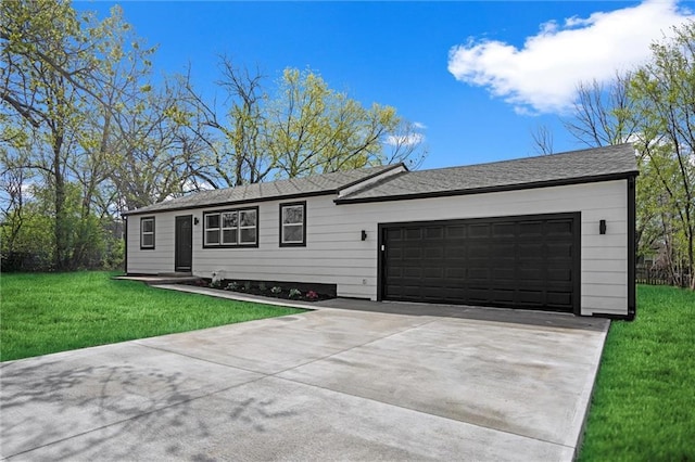 ranch-style home featuring concrete driveway, a front yard, and a garage