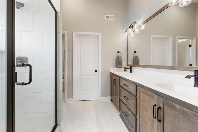 16955 W 168th Ter, Olathe, KS 66062 - full bathroom with a sink, marble finish floor, visible vents, a stall shower, and double vanity