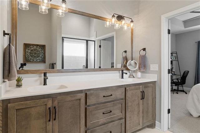 16955 W 168th Ter, Olathe, KS 66062 - bathroom with a sink, double vanity, and baseboards