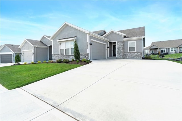 16955 W 168th Ter, Olathe, KS 66062 - view of front facade with driveway, a garage, stucco siding, stone siding, and a front lawn