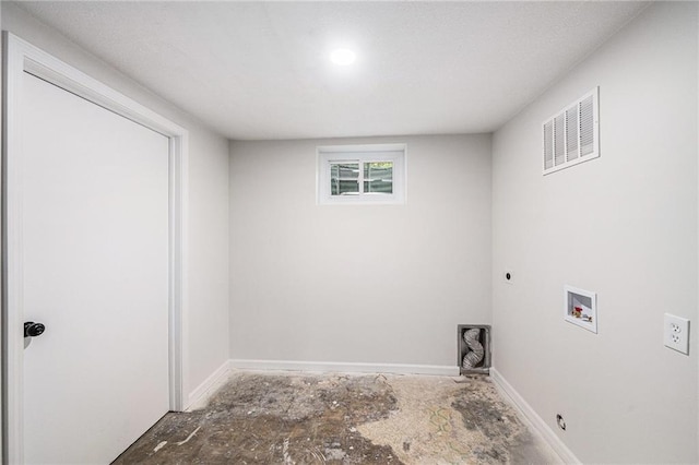 clothes washing area with hookup for a washing machine, electric dryer hookup, and baseboards