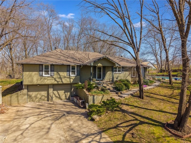 ranch-style house with an attached garage and driveway
