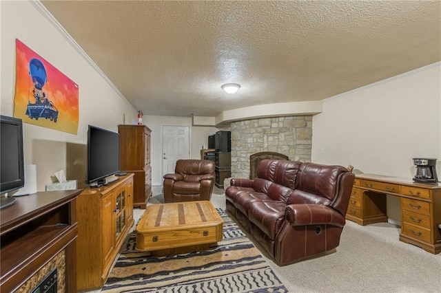 carpeted living room featuring a stone fireplace, a textured ceiling, and ornamental molding