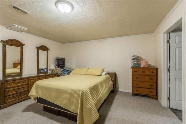 bedroom featuring crown molding, visible vents, light carpet, and a textured ceiling