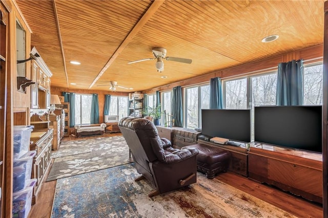 interior space with a ceiling fan, plenty of natural light, and wood ceiling