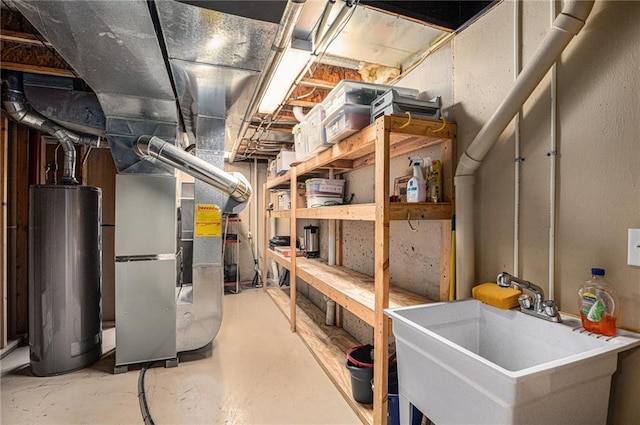 unfinished basement featuring a sink, heating unit, and gas water heater