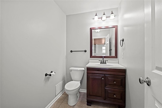 half bathroom with vanity, toilet, tile patterned floors, baseboards, and visible vents