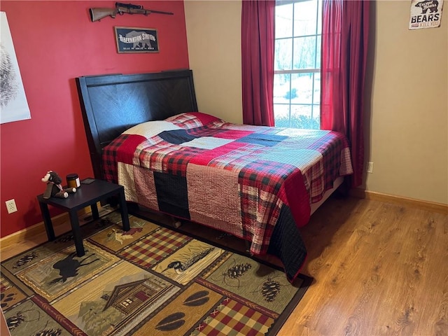 12301 S Stubbs Rd, Overbrook, KS 66524 - bedroom featuring wood finished floors and baseboards