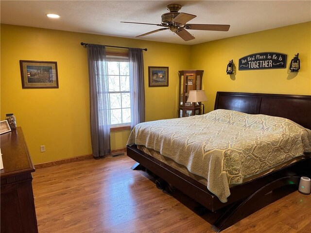 12301 S Stubbs Rd, Overbrook, KS 66524 - bedroom featuring wood finished floors, ceiling fan, and recessed lighting