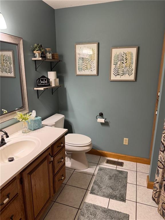 12301 S Stubbs Rd, Overbrook, KS 66524 - full bath featuring vanity and tile patterned floors