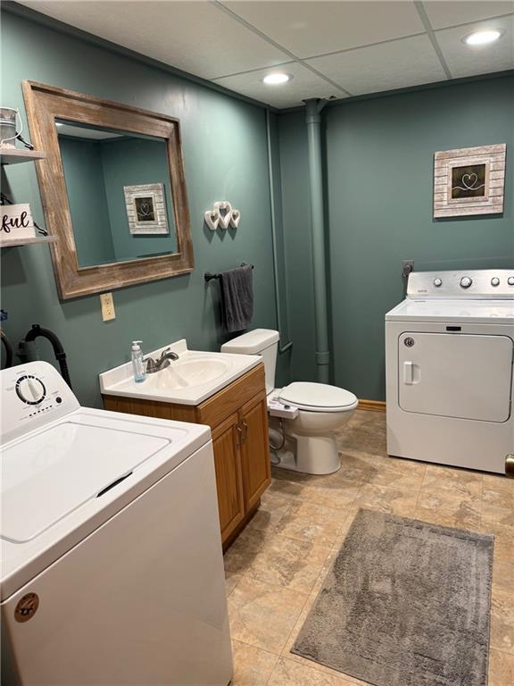 12301 S Stubbs Rd, Overbrook, KS 66524 - washroom featuring recessed lighting and washer and clothes dryer