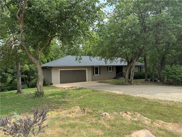 12301 S Stubbs Rd, Overbrook, KS 66524 - ranch-style house with concrete driveway, a garage, and a front lawn