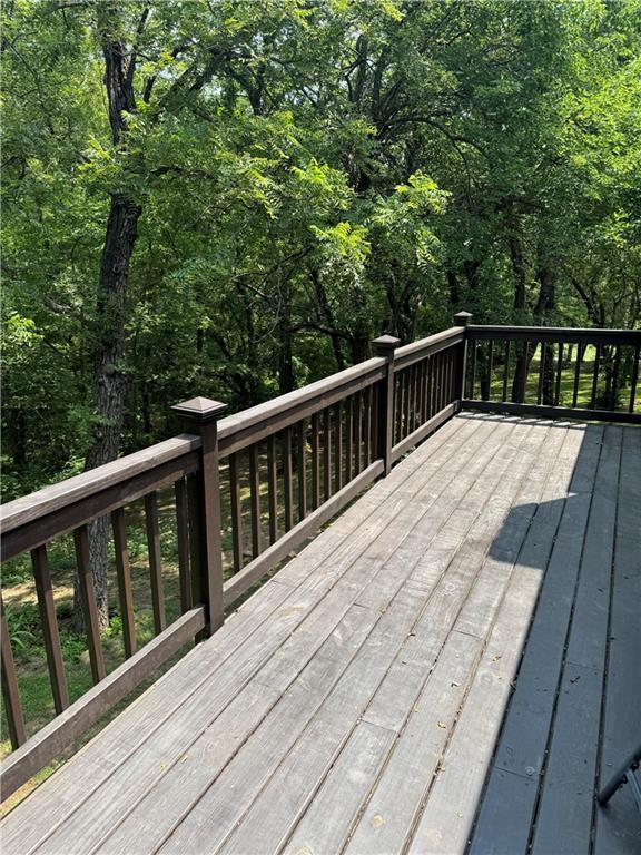 12301 S Stubbs Rd, Overbrook, KS 66524 - wooden deck with a view of trees