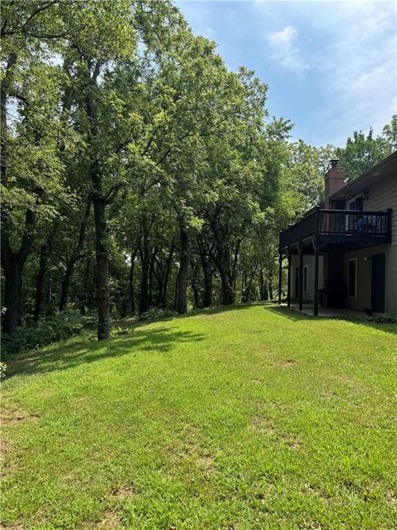 12301 S Stubbs Rd, Overbrook, KS 66524 - view of green lawn featuring a wooden deck