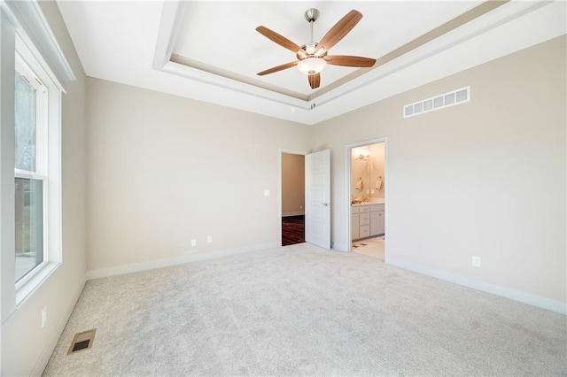 9435 N Belton Ave, Kansas City, MO 64154 - spare room with a ceiling fan, visible vents, and light carpet