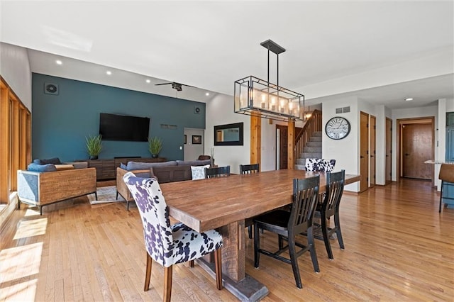 dining space with recessed lighting, visible vents, light wood-style flooring, and stairway