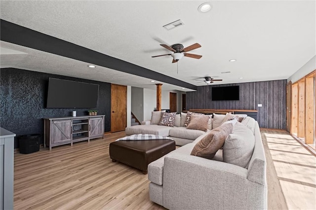 living area with a ceiling fan, visible vents, stairs, recessed lighting, and light wood-style flooring