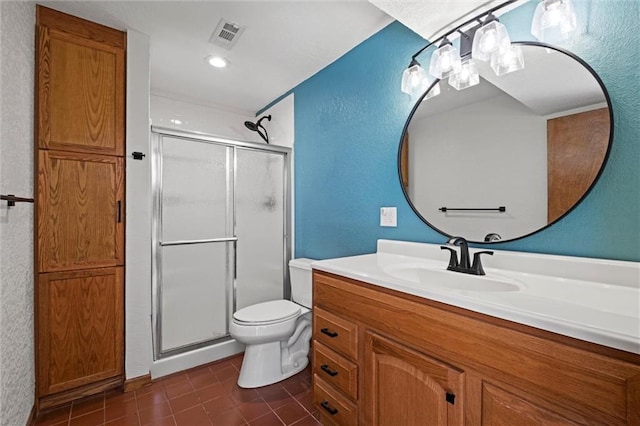 full bath featuring tile patterned flooring, vanity, a textured wall, toilet, and a shower stall