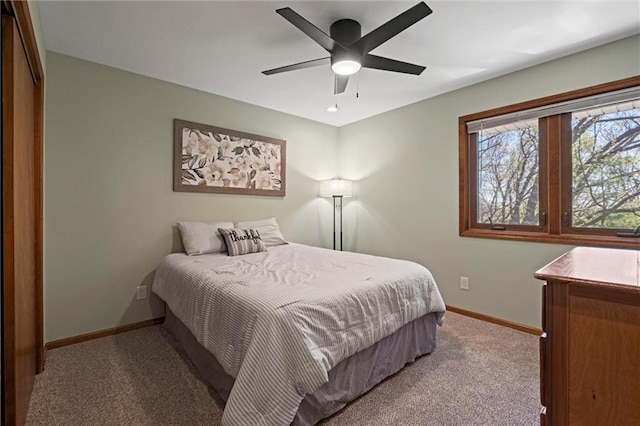 bedroom with carpet floors, a ceiling fan, and baseboards