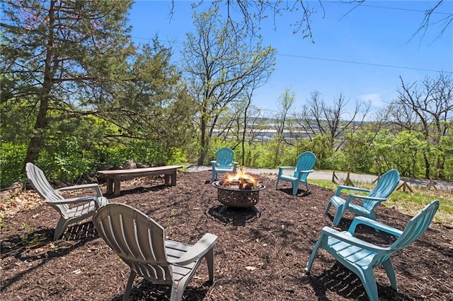 view of yard featuring an outdoor fire pit