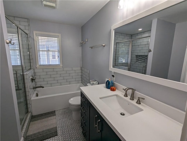 301 S 6th St, Hiawatha, KS 66434 - full bathroom with a bathtub, toilet, visible vents, a shower stall, and vanity