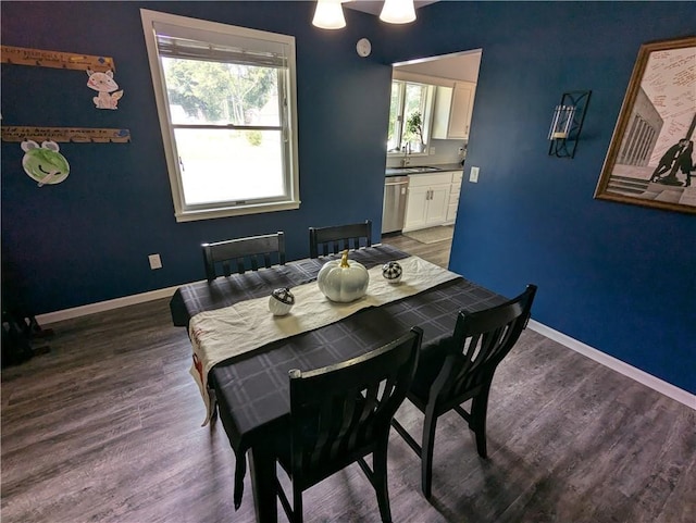 301 S 6th St, Hiawatha, KS 66434 - dining space with baseboards and wood finished floors