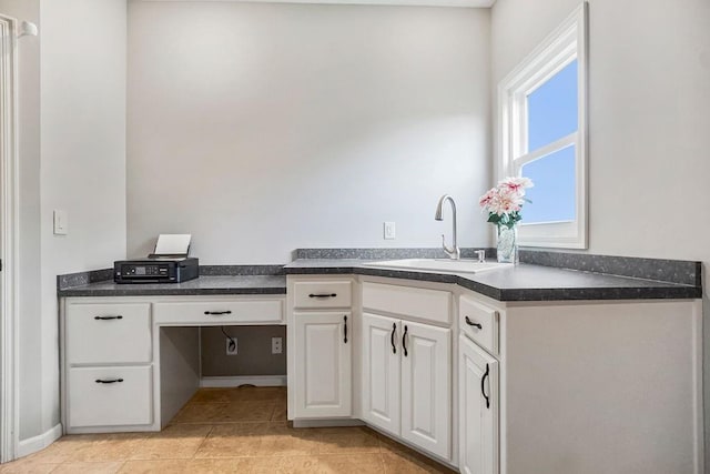 interior space featuring vanity and tile patterned flooring