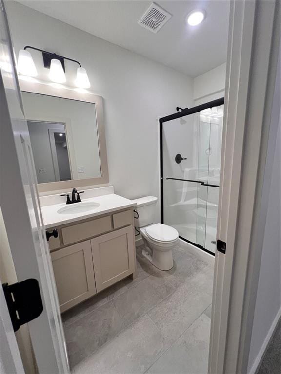 16372 Spring Valley St, Gardner, KS 66030 - bathroom featuring a shower stall, vanity, and toilet