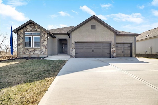 9331 N Belton Ave, Kansas City, MO 64154 - view of front facade featuring a front yard, concrete driveway, an attached garage, stone siding, and stucco siding
