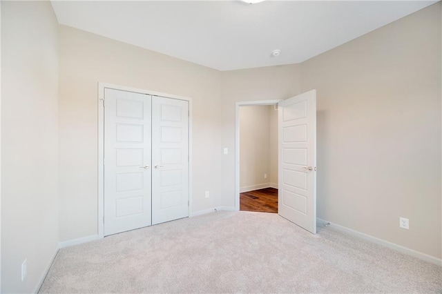 9331 N Belton Ave, Kansas City, MO 64154 - unfurnished bedroom featuring baseboards, carpet, and a closet