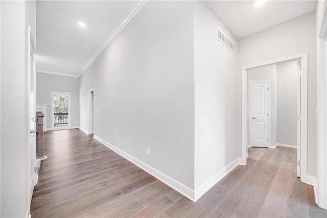9335 N Belton Ave, Kansas City, MO 64154 - corridor with crown molding, baseboards, visible vents, and wood finished floors