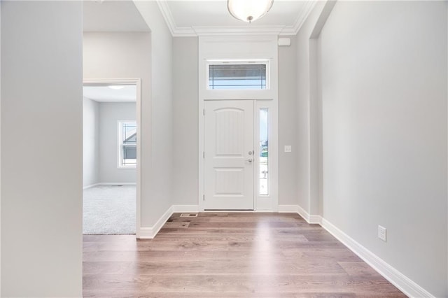 9335 N Belton Ave, Kansas City, MO 64154 - entrance foyer featuring baseboards, ornamental molding, and wood finished floors