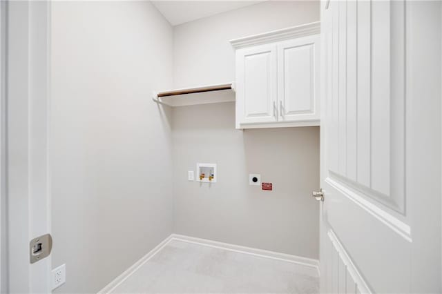 9335 N Belton Ave, Kansas City, MO 64154 - laundry area featuring cabinet space, electric dryer hookup, baseboards, and hookup for a washing machine