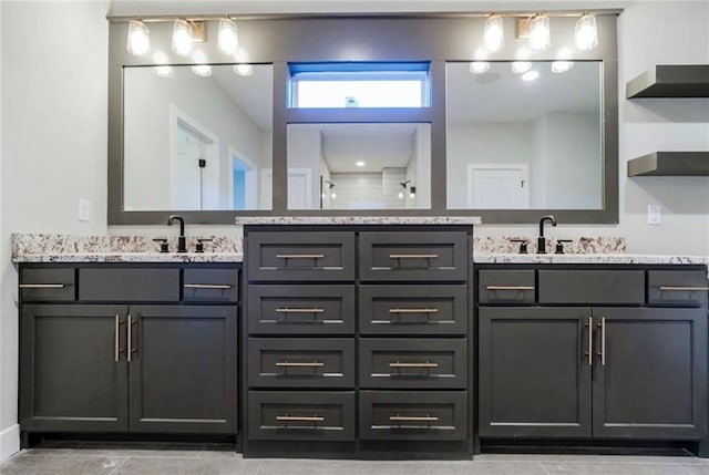 3217 SW Saddlebred Ter, Lees Summit, MO 64082 - bathroom featuring double vanity, a tile shower, and tile patterned floors
