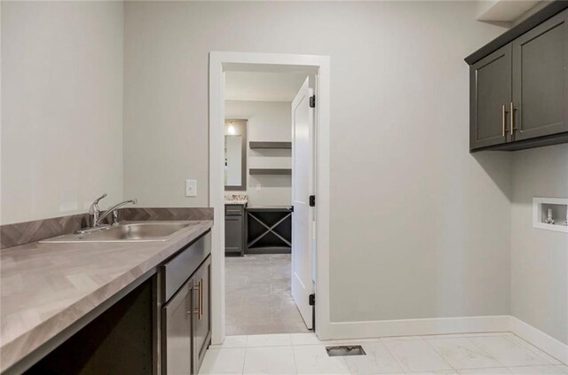 3217 SW Saddlebred Ter, Lees Summit, MO 64082 - washroom with cabinet space, washer hookup, and baseboards